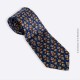 Cravate en soie grise Pierre Cardin Vintage, motif fleur de lys stylisé sur fond bleu marine