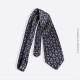 Cravate en soie grise Pierre Cardin Vintage, motif fleur de lys stylisé sur fond bleu marine